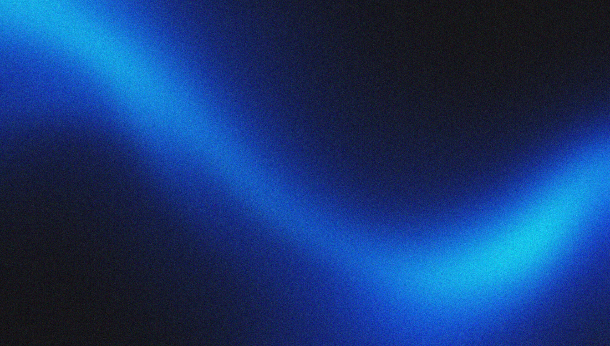 A bright, wavy blue light streaks diagonally across a dark background, creating a glowing, abstract pattern.